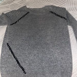 Gray sweater with bits of leather